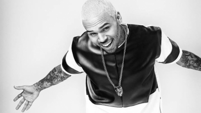 Chris brown throws up gang signs